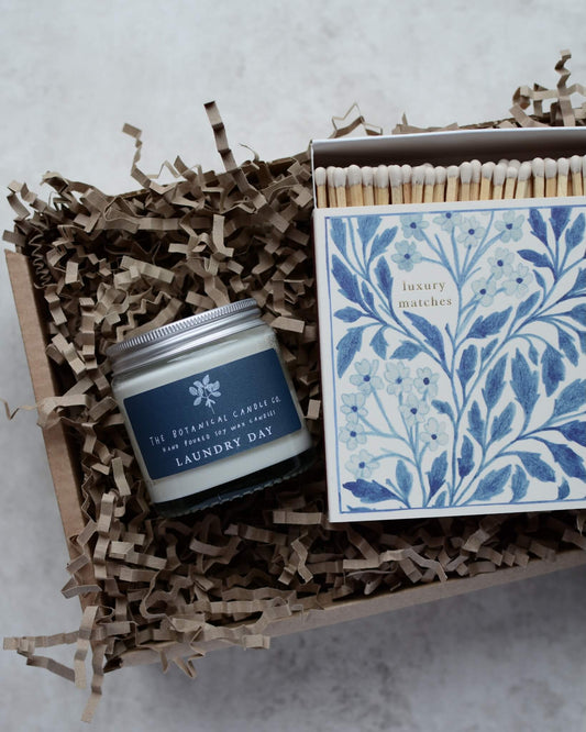 A blue and white themed candle gift box.