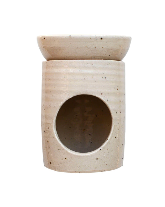 A ceramic oatmeal-coloured oil burner, on a white background.