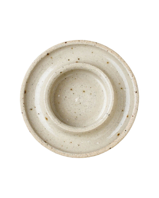 An oatmeal ceramic pillar candle holder, on a white background.