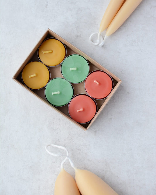 Colourful beeswax tealights in Spring colours.