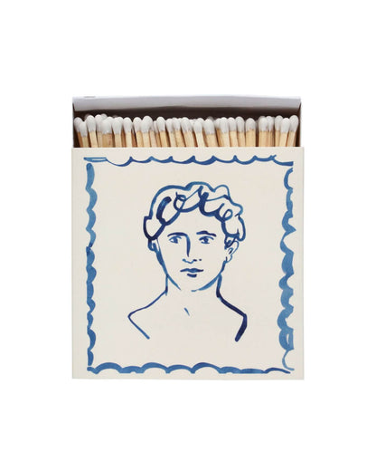 Blue and white square match box, with an illustration of a man.