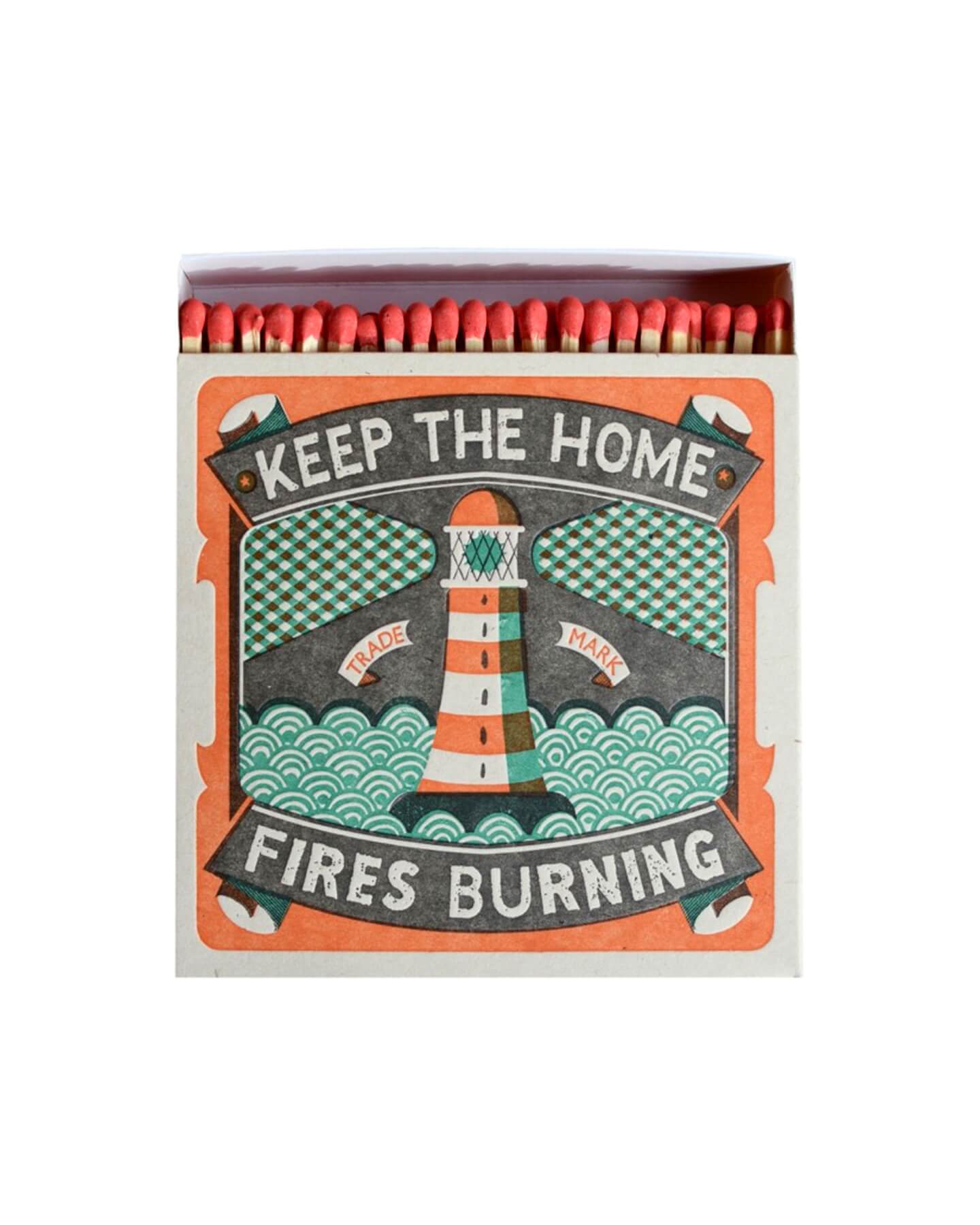 A letterpress design match box with an illustration of a lighthouse and the words 'keep the home fires burning'.