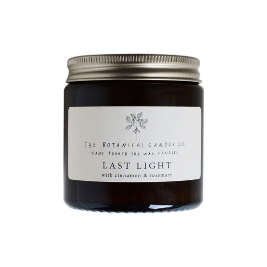 Last Light Scented Soy Candle in amber jar.