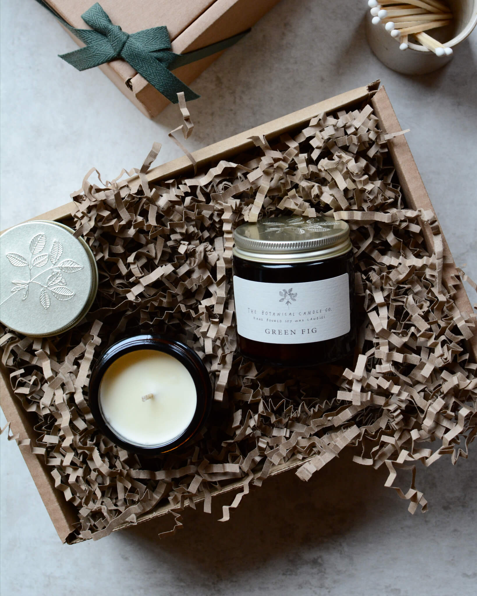 Pair of scented candles within a gift box.