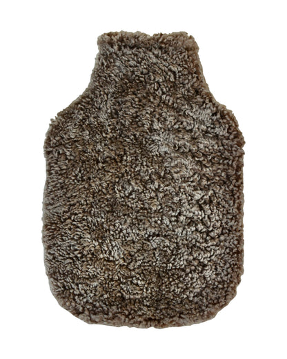 A brown sheepskin hot water bottle on a white background.