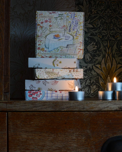 Garden Picnic scented tealights with a hand-illustrated box design, depicting a summer garden.