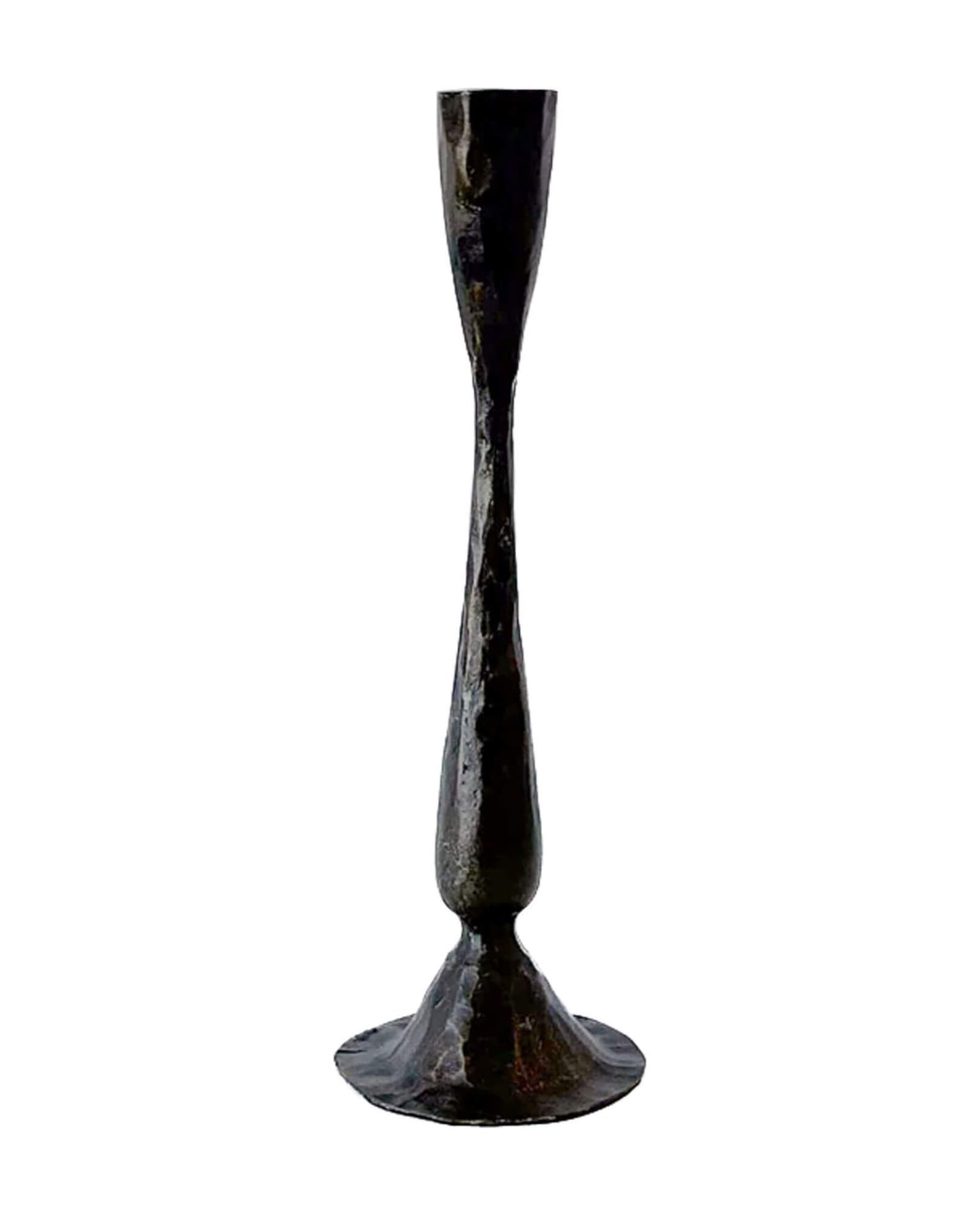 A tall metal candlestick, forged from iron.