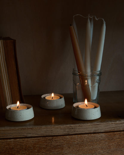 Ceramic tealight holders and beeswax tealights.